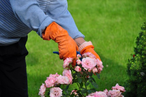 PPE laid out for a gardening job including boots and gloves